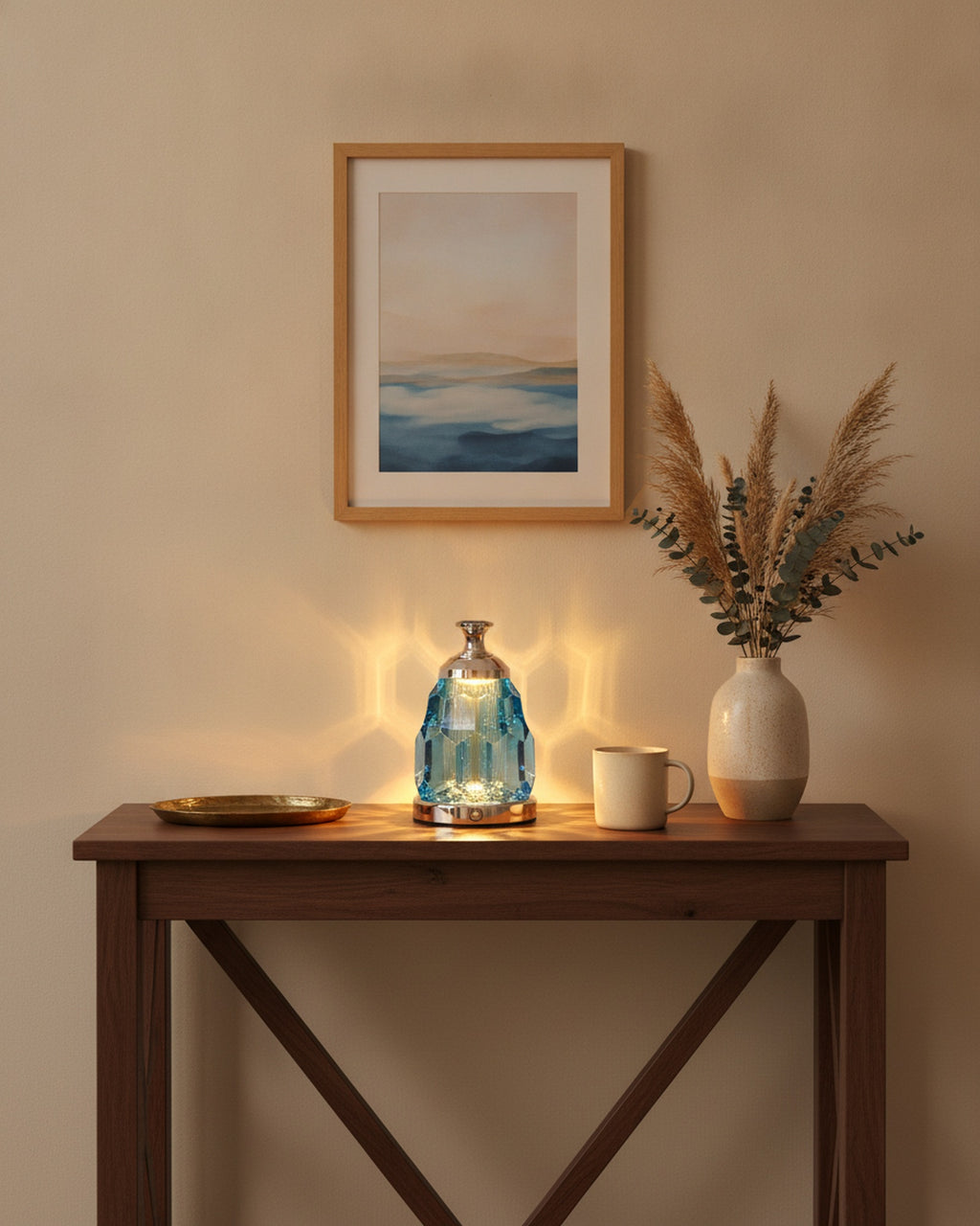 Blue crystal night lamp styled on a walnut entry console with a tray and vase
