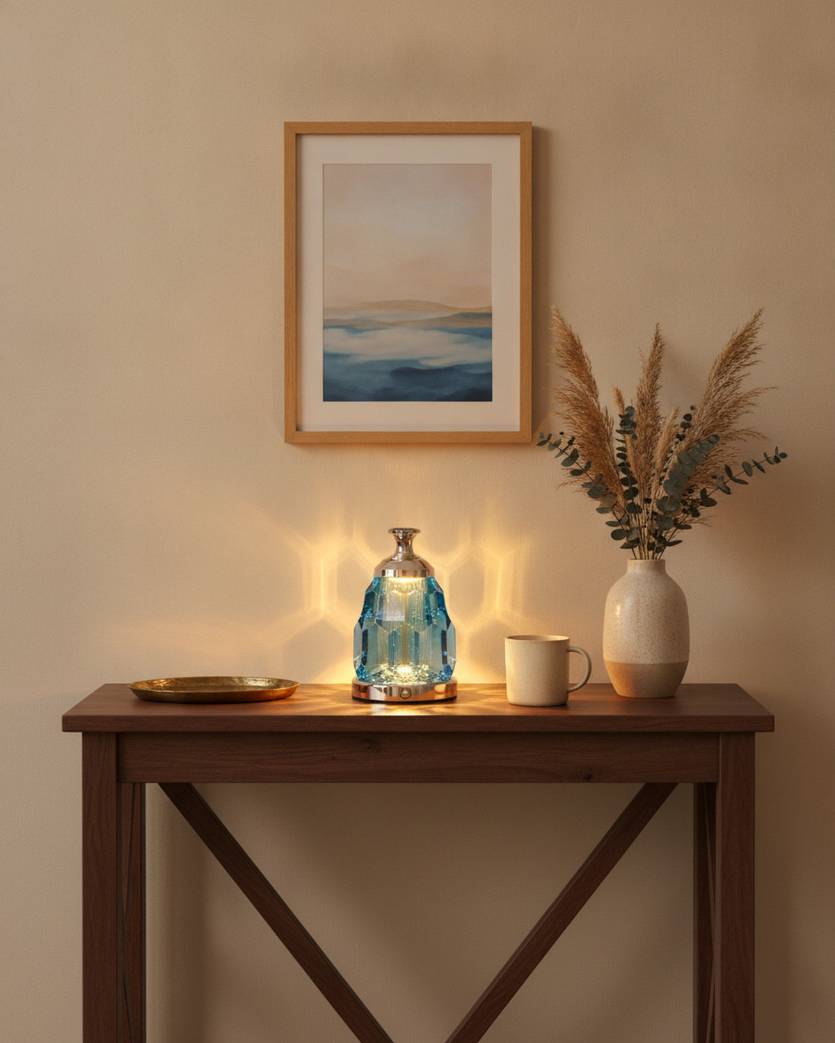 Blue crystal night lamp styled on a walnut entry console with a tray and vase