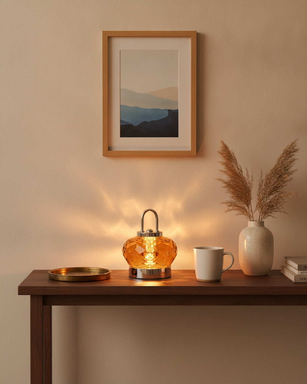 Amber crystal night lamp styled on a walnut entry console with a tray and vase