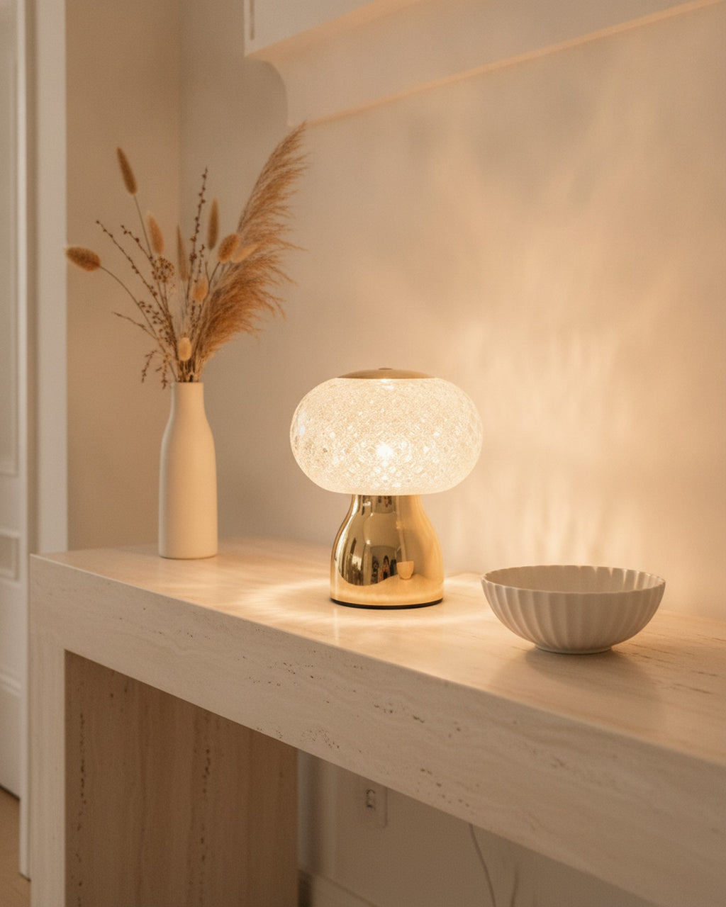 Brilliance faceted crystal accent lamp styled on a travertine entry console