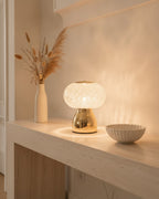 Brilliance faceted crystal accent lamp styled on a travertine entry console