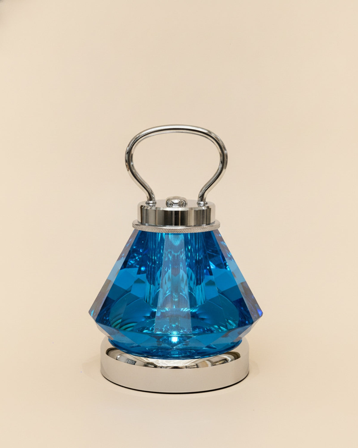 2658-L Sapphire Blue Tapered Faceted Crystal Lamp with Handle on warm ivory backdrop