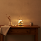 Nivin crystal lantern glowing on a wooden console table in a warm entryway