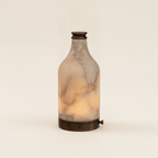 Admire alabaster accent lamp glowing on a warm cream background