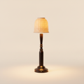 Bliss ceramic table lamp with African Blackwood base, brass ring detail, white shade on warm cream